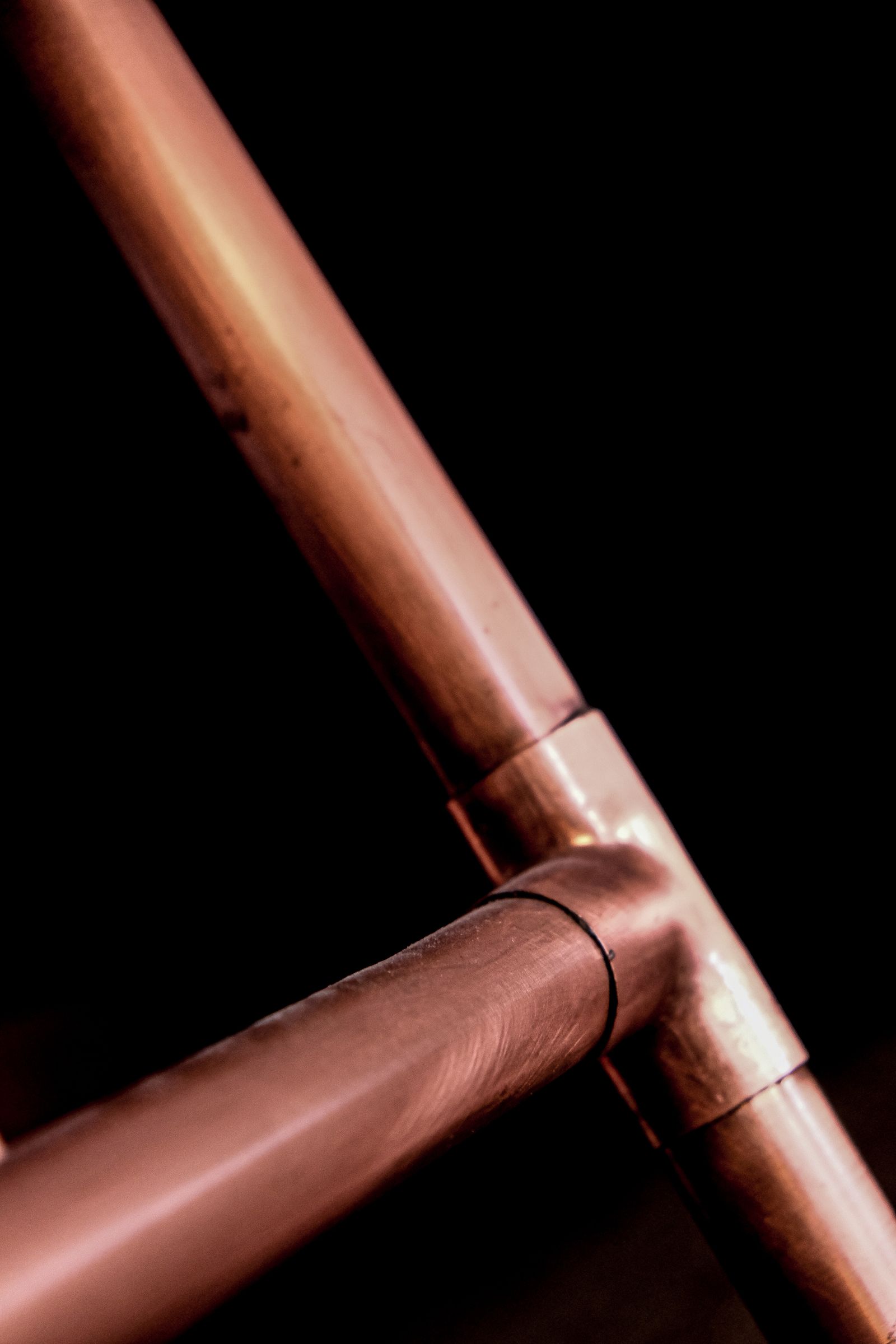 Sample image of copper pipes joined with a tee fitting